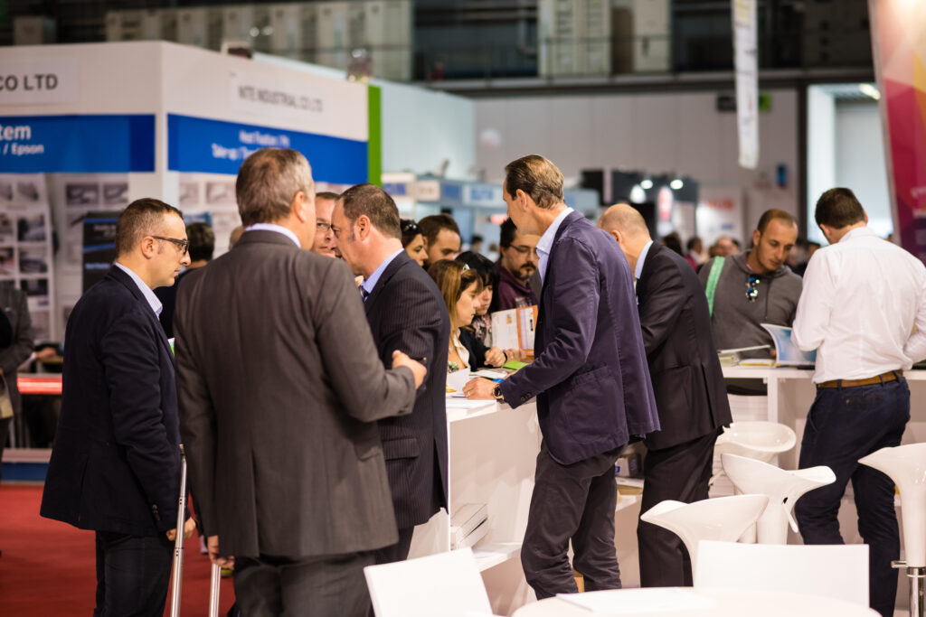 Direct sales reps talking to leads at a public event