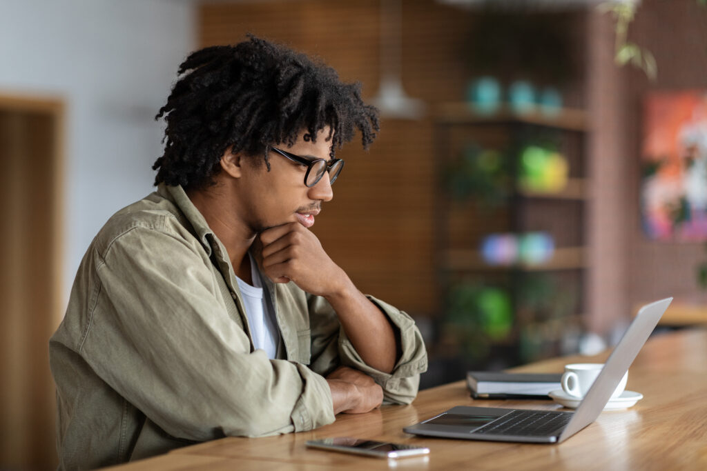 Young adult thinking about a sales career