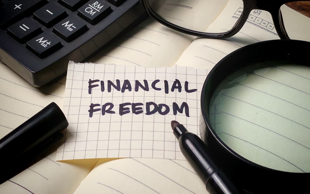 “Financial freedom” written on paper